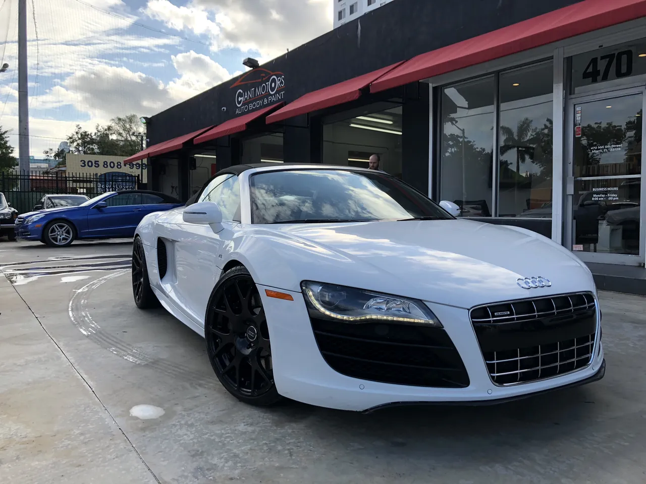 A white Audi R8 outside Giant Motors
