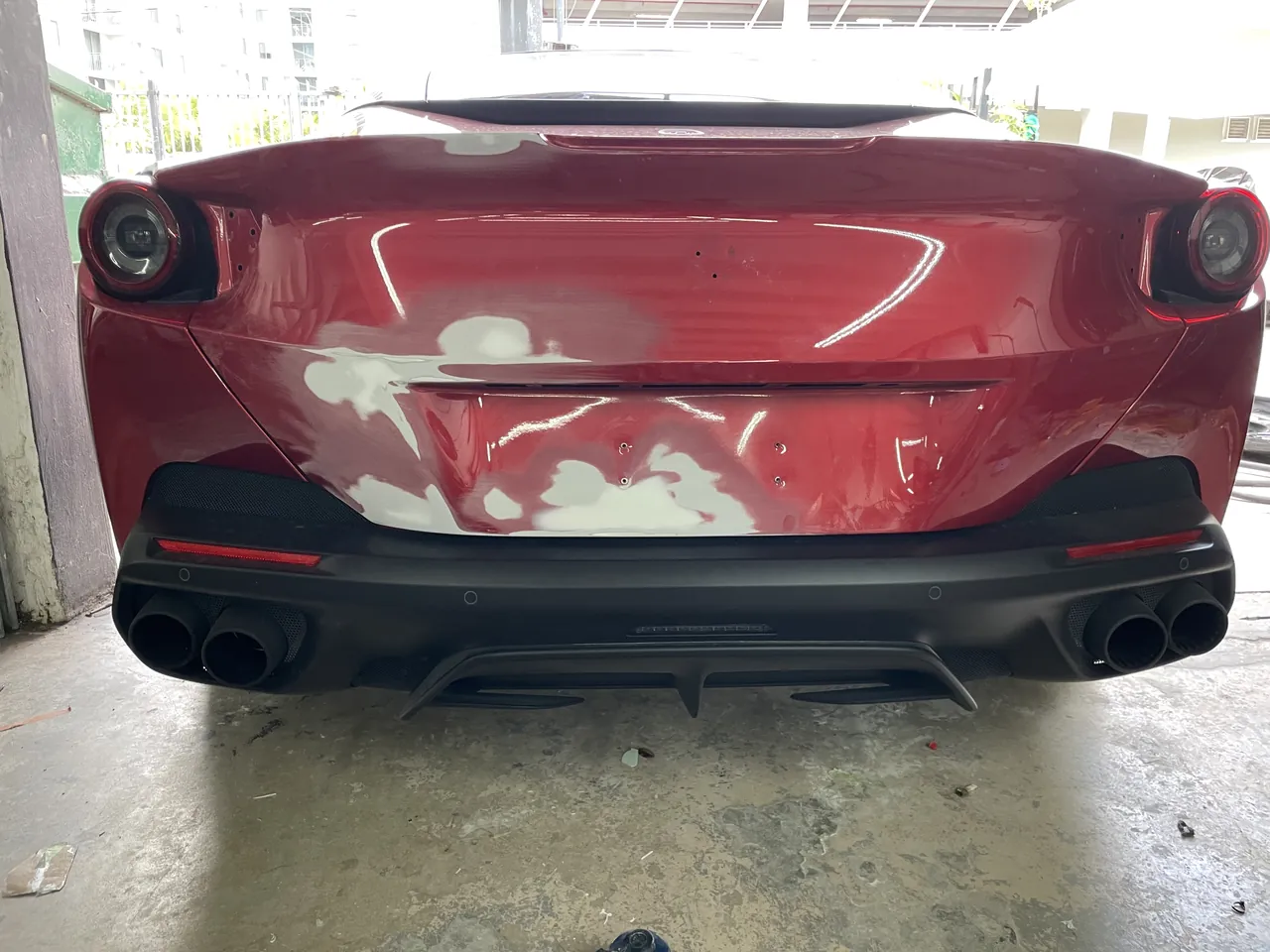 A Ferrari Portofino rear panel prepped with filler for paint at Giant Motors